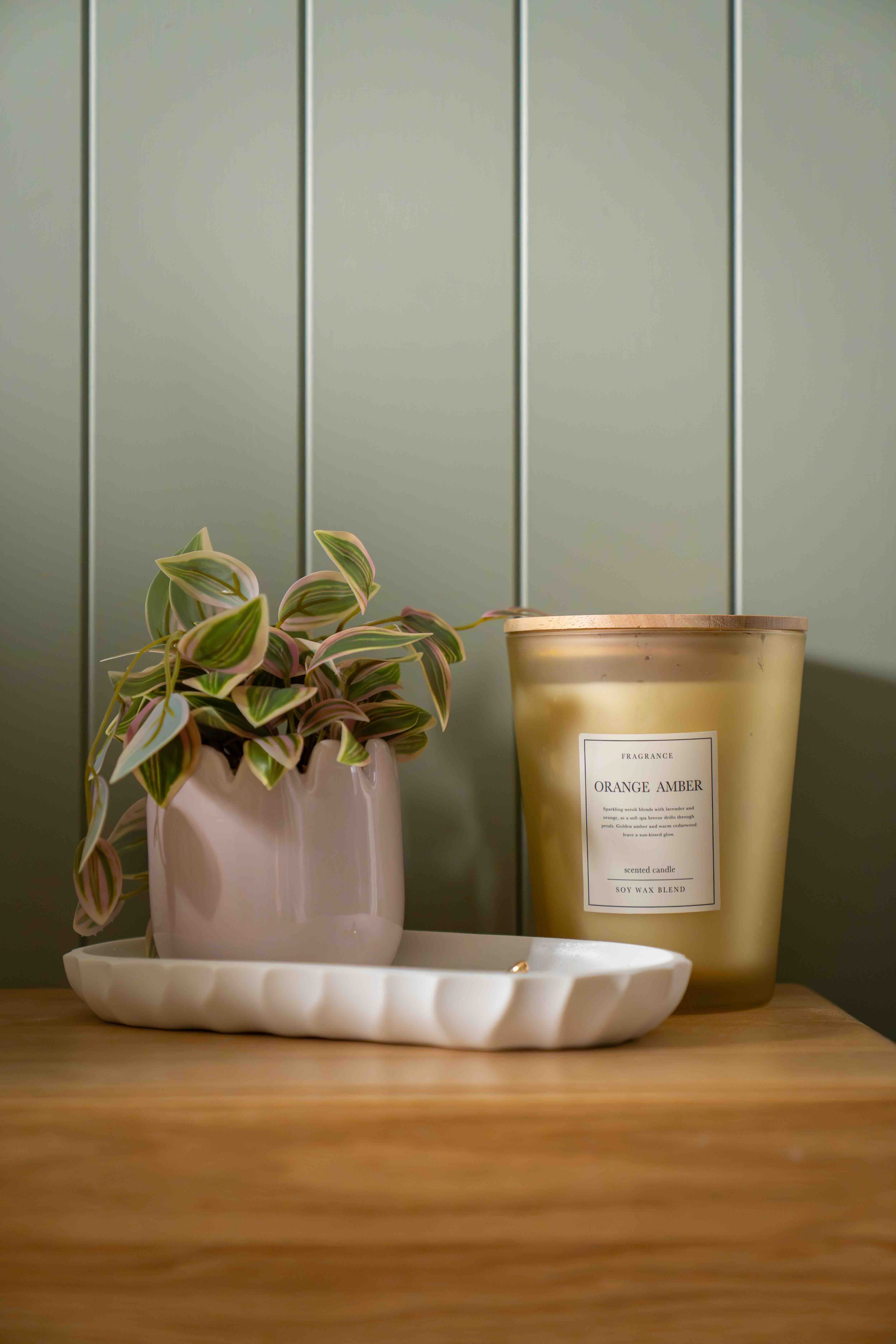 Bedroom candle and plant styling